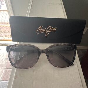 Woman’s Maui Jim’s sun glasses